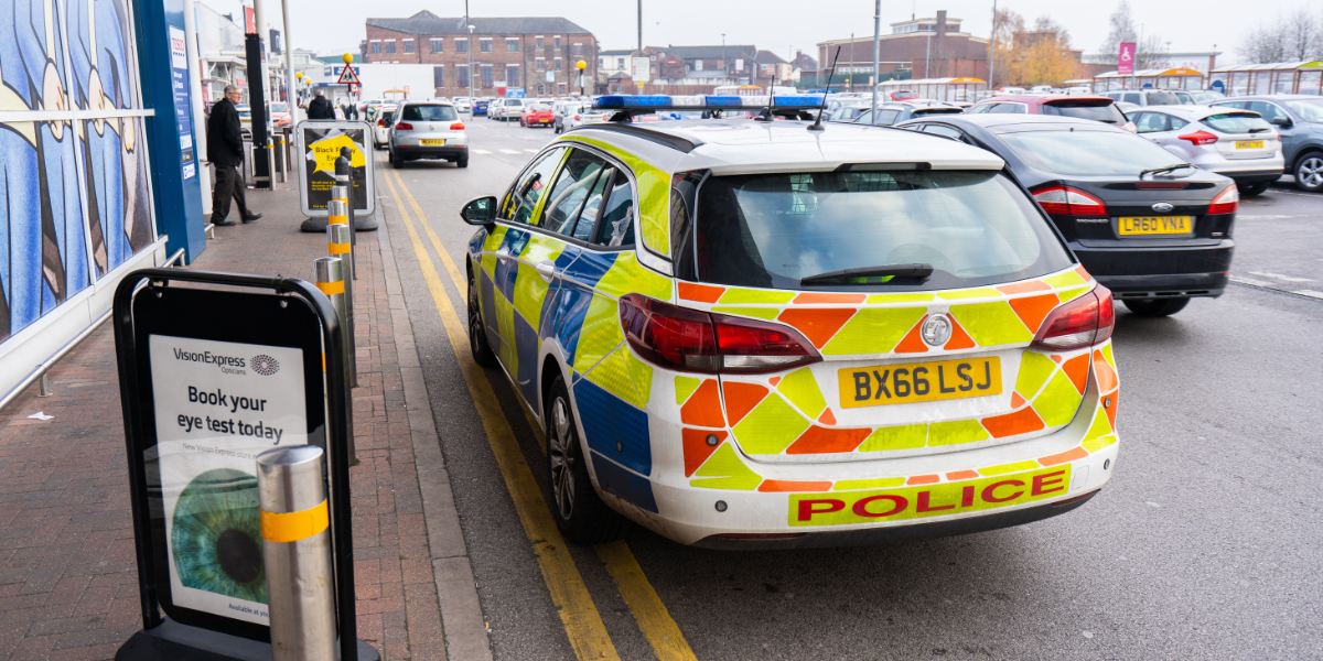 Police car outside shop